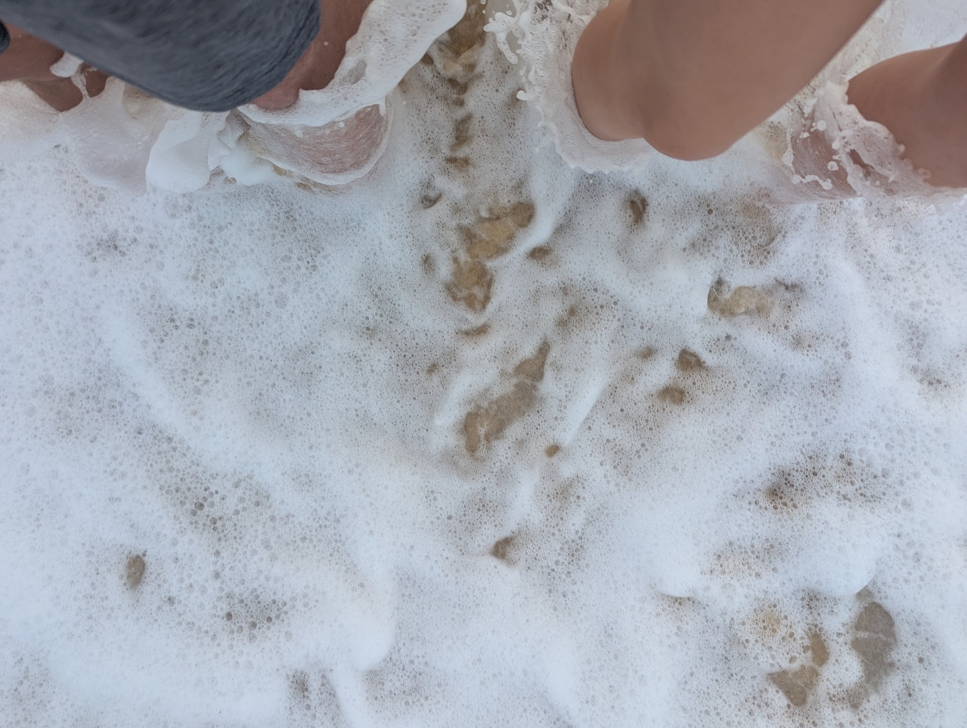Getting our toes very wet at Betka Beach